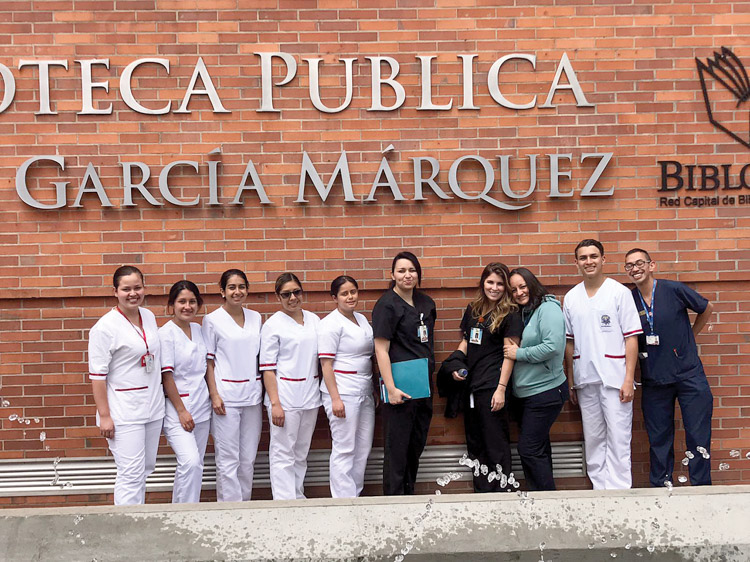 Cecelia Acosta-Cruz, Traditional B.S.N. student, and Sarah Grimmer, Accelerated B.S.N. student (middle in black scrubs), spent spring break in Bogota, Colombia, as part of an educational exchange program with the Universidad Manuela Beltran.