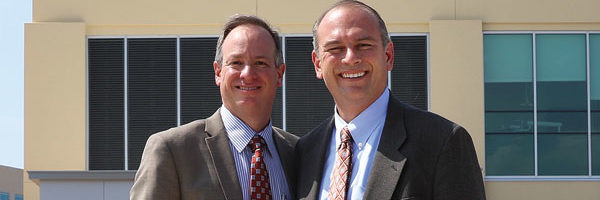 Harris Siegel, D.M.D. (from left), and Skip Dolt, D.D.S., had a fateful meeting on the first day of their residency at the School of Dentistry. Now, 24 years later, the two friends share a dental practice in Atlanta, Georgia.