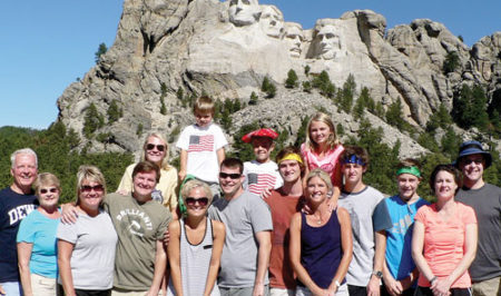 Michael W. Brennan, M.D., and wife Helen (far left) with their children and grandchildren at Mount Rushmore National Memorial.