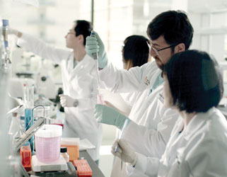 Photo of Students and faculty working in a lab
