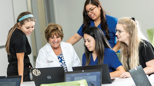 Dana English, Ed.D., M.S., RDH with students Nicole Hernandez, Josefina Bravo and Rachel Cardenas