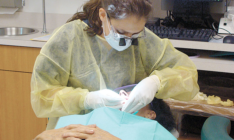 Dental student with patient