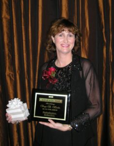 Dr. Hardin poses with her award plaque.