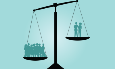 A graphic image of an unbalanced scale with a crowd of patients on one said and two nurses on the other.