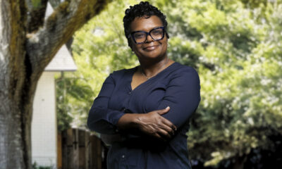 Dr. Fayron Epps poses in front a tree.