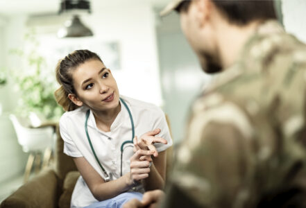 Nurse talks to soldier.